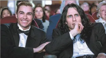  ?? JUSTINA MINTZ — WARNER BROS. ?? Dave Franco, left, and James Franco in the fact-based movie “The Disaster Artist.”