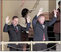  ?? Arkansas Democrat-Gazette/MITCHELL PE MASILUN ?? University of Arkansas,
Fayettevil­le head football coach Chad Morris (left) and UA Athletic Director Hunter Yurachek join in calling the Hogs from the gallery of the state House chamber before Wednesday’s session.