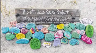  ?? DENISE BARKER/MEGAN MURPHY VIA AP ?? This undated photo provided by Megan Murphy shows an inspiratio­n garden of painted rocks taken at Sandy Neck Beach in Barnstable, Mass., as part of The Kindness Rocks Project.