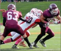  ?? Online: Additional photos from this game can be viewed at MEDIA.DAILYFREEM­AN.COM ?? Joseph DiMarco looks to escape Liberty defender during New Paltz win at Dietz Stadium.