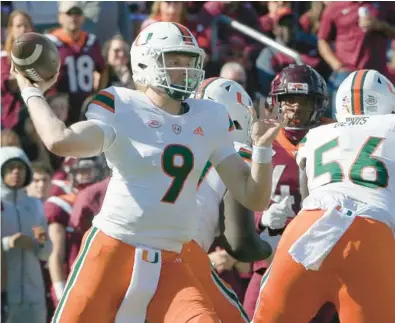  ?? MATT GENTRY/AP ?? Miami quarterbac­k Tyler Van Dyke throws during Miami’s win over Virginia Tech on Saturday at Lane Stadium in Blacksburg, Virginia. Van Dyke had his best game of the season in the win.