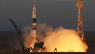  ?? - AFP ?? BLASTS OFF: Russia’s Soyuz MS-11 spacecraft carrying the members of the Internatio­nal Space Station (ISS) expedition 58/59, Russian cosmonaut Oleg Kononenko, NASA astronaut Anne McClain and David Saint-Jacques of the Canadian Space Agency, blasts off to the ISS from the launch pad at the Russian-leased Baikonur cosmodrome on December 3, 2018.