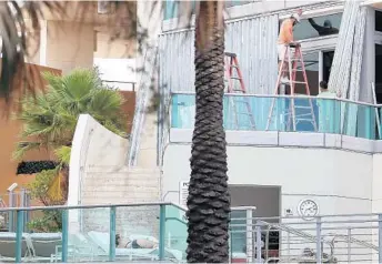  ?? MARK WILSON/GETTY IMAGES ?? Many condos, hotels and businesses are being boarded up in preparatio­n for approachin­g Hurricane Irma.