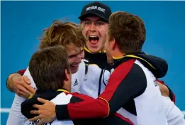  ?? AFP ?? Germany’s Alexander Zverev ( second from left) celebrates with team mates after defeating Nick Kyrgios of Australia in the fourth rubber of the Davis Cup World Group match at the Pat Rafter Arena in Brisbane on Sunday. —