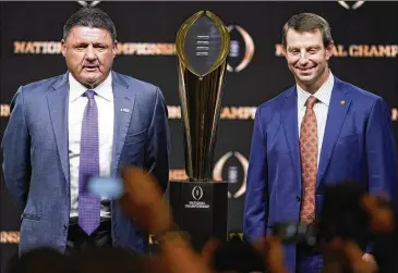  ?? CHRIS CARLSON / ASSOCIATED PRESS ?? Not many will doubt that LSU’s Ed Orgeron (left) and Clemson’s Dabo Swinney have coached teams that deserved to play for the title Monday night. But how many fans outside the Deep South care?