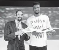  ?? Jamie McCarthy / Getty Images for PUMA ?? Arizona Wildcats big man Deandre Ayton (right) is already hanging with NBA royalty with Walt “Clyde” Frazier at a PUMA Hoops launch in Brooklyn.