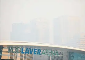  ?? Photo / Getty Images ?? Rod Laver Arena, home of the Australian Open in Melbourne, was shrouded in smoke yesterday.