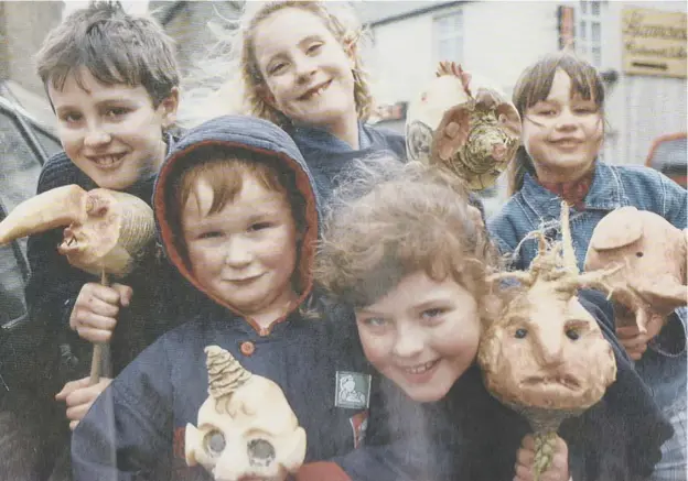  ?? ?? Children in Stromness in the 1980s with their gruesome neep heads for Pop Day, which was marked on November 5.