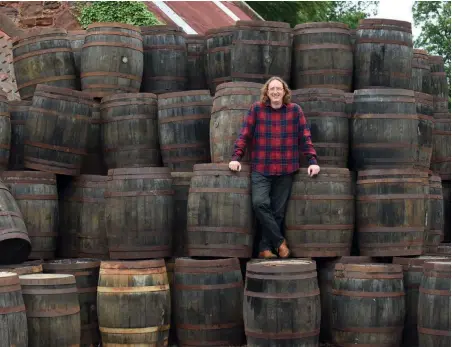  ??  ?? Above: Peter Stuart, co-founder of Thistly Cross Cider, with some of the whisky barrels used for storing and adding flavour to the cider. Right: Heritage varieties.