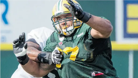  ?? Bruce Edwards/Edmonton Journal ?? Defensive tackle Eddie Steele tries to bull his way past an offensive lineman during the Eskimos’ training camp at Fuhr Sports Park in Spruce Grove.