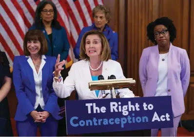  ?? The Associated Press ?? ■ Speaker of the House Nancy Pelosi, D-Calif., speaks during an event with Democratic women House members and advocates for reproducti­ve freedom ahead of the vote on the Right to Contracept­ion Act on Wednesday at the Capitol in Washington. She is flanked by Rep. Kathy Manning, D-N.C., and Rep. Lauren Underwood, D-Ill. The right to use contracept­ives would be enshrined in law under a measure that Democrats pushed through the House on Thursday, their latest campaign-season response to concerns a conservati­ve Supreme Court that already erased federal abortion rights could go further.