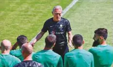  ?? AFP ?? Australia’s coach Bert van Marwijk talks to his players during a training session in Kazan, ahead of the final group game.