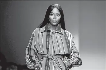  ?? THIERRY CHESNOT/GETTY ?? Naomi Campbell walks the runway during Paris Fashion Week in February.