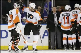  ?? SETH WENIG — THE ASSOCIATED PRESS ?? Philadelph­ia Flyers goaltender Carter Hart, left, and Jakub Voracek celebrate after the NHL hockey game against the New York Rangers, Sunday in New York.