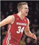  ?? HARRISON BARDEN-USA TODAY SPORTS ?? UW guard Brad Davison celebrates his three-pointer against Minnesota on Wednesday night.