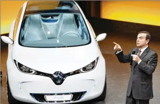  ?? ASSOCIATED PRESS 2011 ?? Renault-Nissan-Mitsubishi Chief Executive Officer Carlos Ghosn presents the Renault ZOE electric car at Renault’s headquarte­rs near Paris in 2011. The alliance is ramping up electric car production, vowing 12 new models by 2022.