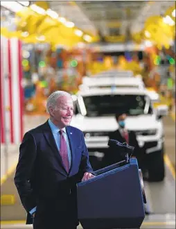  ?? EVAN VUCCI Associated Press ?? PRESIDENT BIDEN speaks during a visit to a General Motors electric vehicle assembly plant in Detroit in 2021.
