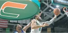  ?? DAVID SANTIAGO/COURTESY ?? Miami Hurricanes guard Bruce Brown, right, scored a game-high 25 points in the team’s final regular-season home game of the year.