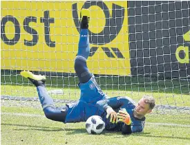  ??  ?? Germany goalkeeper Manuel Neuer saves a shot during a training match.