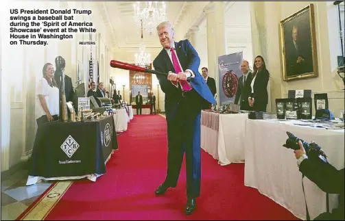  ?? REUTERS ?? US President Donald Trump swings a baseball bat during the ‘Spirit of America Showcase’ event at the White House in Washington on Thursday.