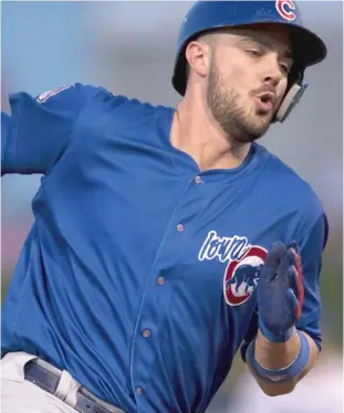  ?? KAYLA WOLF/AP ?? Kris Bryant, playing for Class AAA Iowa on Monday on his rehab assignment, rounds third base to score against Omaha in the top of the fourth inning in Papillion, Neb.
