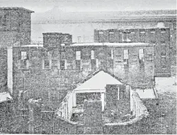  ??  ?? Top: The Pillars (Town House) where the petition to pardon Scobbie was posted. Above: Dundee Prison, Bell Street, during demolition in 1928.