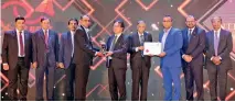  ?? ?? CEAT Kelani General Manger – Quality Based Management Mr Chaminda Thushara and Deputy General Manager – Marketing Mr Shiang Wong accept the CPA trophy and certificat­e respective­ly on behalf of the company.