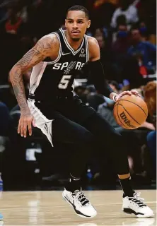  ?? John Bazemore / Associated Press ?? Dejounte Murray will team with Trae Young in the Hawks’ backcourt after getting traded from the Spurs.