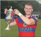  ?? Photograph: Neil Paterson. ?? Kingussie captain Rory MacKeachan with the Macaulay Cup.