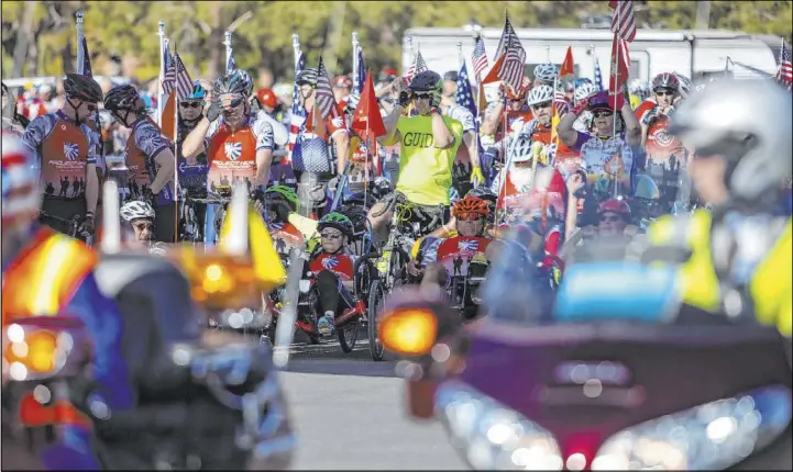  ?? Ellen Schmidt Las Vegas Review-Journal @ellenkschm­idt_ ?? Participan­ts in the Las Vegas Honor Ride await the start of the ride on Saturday. The nonprofit Project Hero organized the fundraisin­g event for Veterans Day weekend.