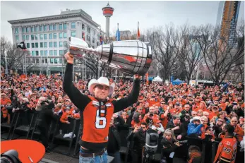  ?? CP PHOTO ?? Rob Maver of the Calgary Stampeders celebrates with the Grey Cup during a public ceremony in Calgary on Tuesday.