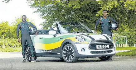  ?? CONTRIBUTE­D ?? Jamaican bobsledder­s Shadwayne Stephens (left) and Nimroy Turgott pose beside a convertibl­e MINI Coupe. The car was provided by BMW to assist in the Jamaicans’ training, after a video showing the pair pushing a similar model during a training exercise, went viral.