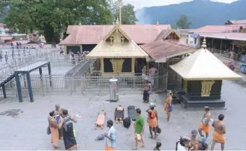  ?? — AFP ?? In this file photo taken on October 18, Hindu devotees are pictured at the Sabarimala hilltop temple in Kerala.