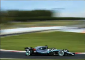  ?? THE ASSOCIATED PRESS ?? Mercedes driver Lewis Hamilton of Britain steers his car during a Formula One pre-season testing session in Montmelo, outside Barcelona, Spain, Friday.