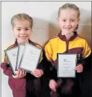  ?? Photo / Supplied ?? Step One Te Awamutu gymnasts Bayley Dudson (left) and Willow Parker with their certificat­es from the Midlands Junior Championsh­ips in Rotorua.