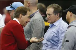  ?? ASSOCIATED PRESS FILE PHOTO ?? Alabama coach Nick Saban, left, speaks with New England Patriots coach Bill Belichick during a pro day last March in Tuscaloosa, Ala.