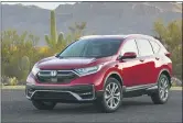  ?? GENE J. PUSKAR (LEFT); WES ALLISON — THE ASSOCIATED PRESS ?? The Toyota RAV4Hybrid, left, and the Honda CR-V Hybrid are similar in fuel economy, power and practicali­ty according to Edmunds. Each is a smart buy for a fuel-efficient SUV..