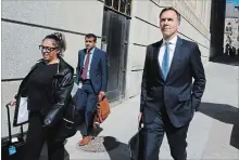  ?? PATRICK DOYLE THE CANADIAN PRESS ?? Finance Minister Bill Morneau leaves a press conference after speaking about the Trans Mountain Expansion project in Ottawa on Wednesday.