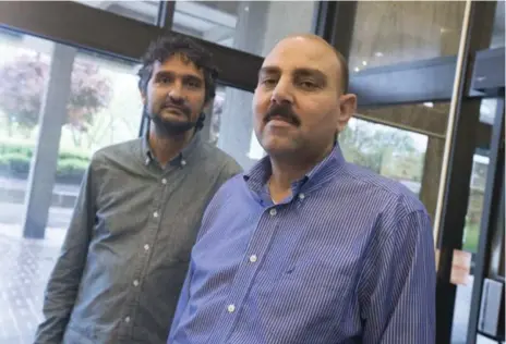  ?? BERNARD WEIL/TORONTO STAR ?? Ahmad Al Rasoul, right, with supporter Omar Khan, worked as a driver before and after he fled Syria but he can’t yet take his G licence test in Ontario.