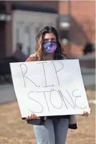  ??  ?? BGSU student Maya Elias joined the protest outside Pi Kappa Alpha at Bowling Green State University.