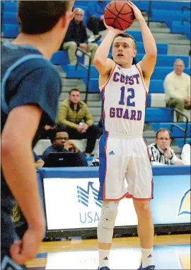  ?? DANA JENSEN/THE DAY ?? Coast Guard’s Packy Witkowski (12) goes up for a 3-point shot during Thursday’s game against Connecticu­t College at the Roland Field House in New London. Coast Guard won 101-72. Please go to theday.com to view a photo gallery from the game.