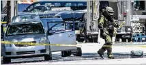  ?? JOHN SPINK / JSPINK@AJC.COM ?? The Atlanta police bomb squad removes items in veteran John Michael Watts’ car Tuesday at the state Capitol.