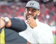  ?? Serena Morones for/oregonlive.com/TnS ?? Former Oregon Ducks quarterbac­k Marcus Mariota looks on as the No. 10 Oregon Ducks warm up for the Pac-12 football championsh­ip game against the No. 17 Utah Utes at Allegiant Stadium in Las Vegas on Friday, Dec. 3, 2021.