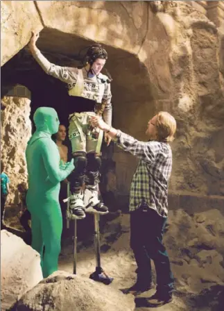  ??  ?? DIRECTOR Andrew Stanton, right, works with Willem Dafoe, in a CG suit and on stilts to play a Thark. “John Carter” arrives in theaters 100 years after the first John Carter story was published.