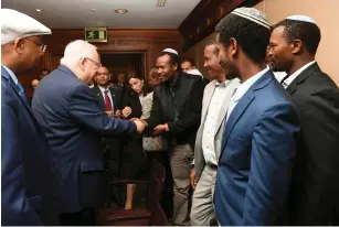  ?? (Mark Neyman/GPO) ?? PRESIDENT REUVEN RIVLIN and Likud MK Avraham Neguise (left) meet with representa­tives of the Falash Mura community in Ethiopia yesterday.