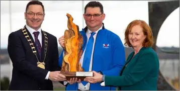  ??  ?? Damian Donlon of Dulann Ltd is presented with the Wexford Enterprise Award by County Council Chairman Michael Sheehan and Breege Cosgrave, Senior Enterprise Developmen­t Officer, LEO Wexford.