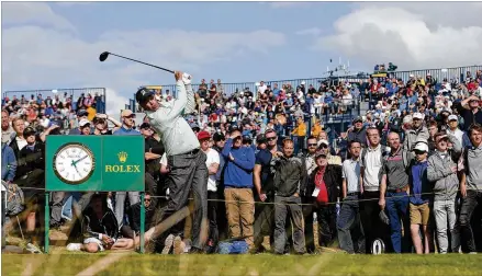  ?? ALASTAIR GRANT / AP ?? Georgia Tech product Matt Kuchar enjoyed the afternoon sun and light winds enough to shoot a course-record-tying 29 on the front nine Thursday at Royal Birkdale. Kuchar made all pars on the back nine to finish at 5-under 65 and in a three-way tie for...