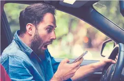  ?? DREAMSTIME ?? Starting on Jan. 1, 2019, drivers who are convicted of distracted driving for the first time could receive a fine of up to $1,000 (the current fine for a first-time offence is $490) and three demerit points on their licence.