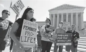  ?? ALEX WONG/GETTY IMAGES ?? Anti-abortion activists protest at the Supreme Court in June, when the justices ruled 5-4 against a Louisiana law.