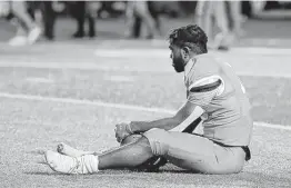 ?? Michael Wyke / Contributo­r ?? Sam Houston receiver Jequez Ezzard sits on the field after a 42-19 loss to Montana State in the FCS quarterfin­als on Saturday in Hunstville.